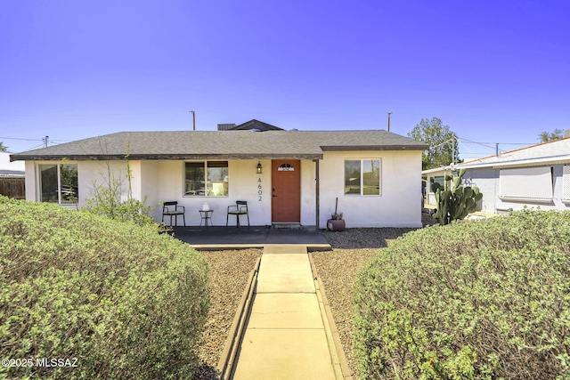 4602 E Holmes St, Tucson, AZ 85711 - ranch-style home with a shingled roof and stucco siding
