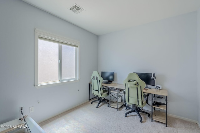 carpeted home office featuring visible vents