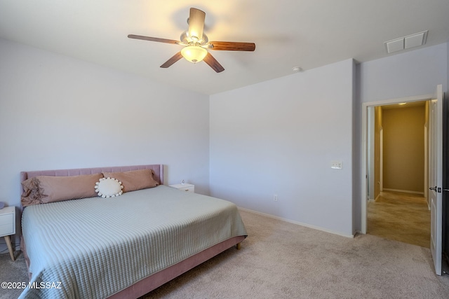 bedroom with a ceiling fan, baseboards, visible vents, and light carpet