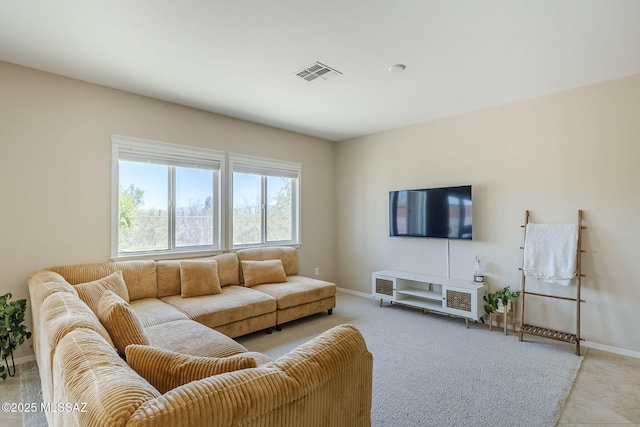 living area featuring visible vents and baseboards
