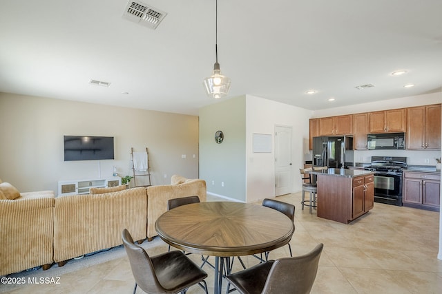 dining space with recessed lighting, light tile patterned flooring, and visible vents