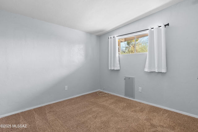carpeted spare room with baseboards