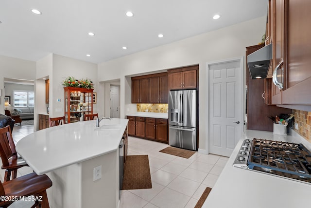 61663 E Talc St, Oracle, AZ 85623 - kitchen with light countertops, visible vents, a sink, appliances with stainless steel finishes, and a notable chandelier