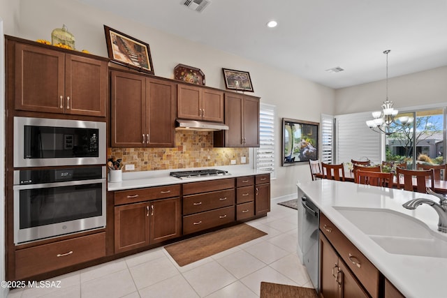 61663 E Talc St, Oracle, AZ 85623 - dining area featuring baseboards, a notable chandelier, and light tile patterned floors