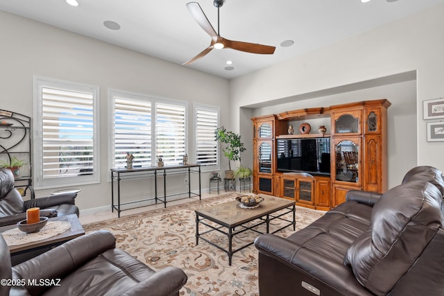 61663 E Talc St, Oracle, AZ 85623 - living room with light tile patterned flooring, bar area, and ceiling fan with notable chandelier