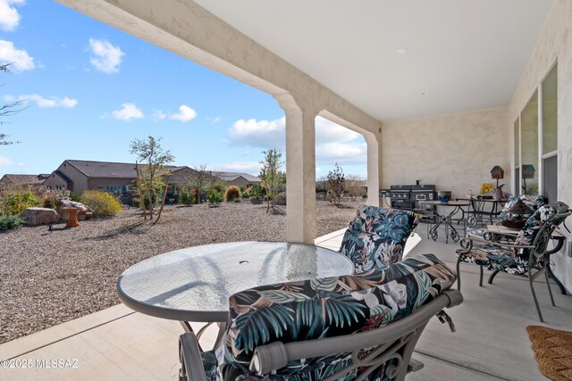 61663 E Talc St, Oracle, AZ 85623 - rear view of house featuring stucco siding, fence, and a patio area