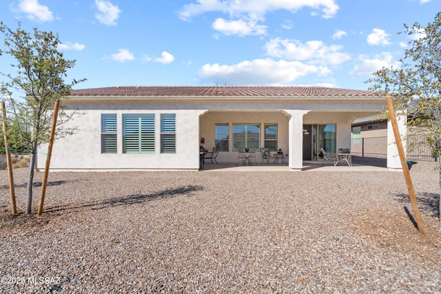 61663 E Talc St, Oracle, AZ 85623 - back of property with fence, a tile roof, a patio, and stucco siding