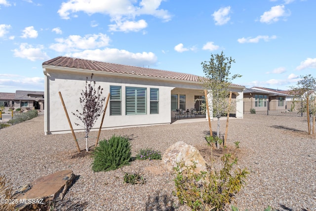 61663 E Talc St, Oracle, AZ 85623 - back of property with fence, a residential view, stucco siding, a tile roof, and a patio area