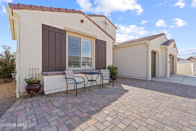 61663 E Talc St, Oracle, AZ 85623 - half bathroom with tile patterned flooring, toilet, baseboards, and a sink