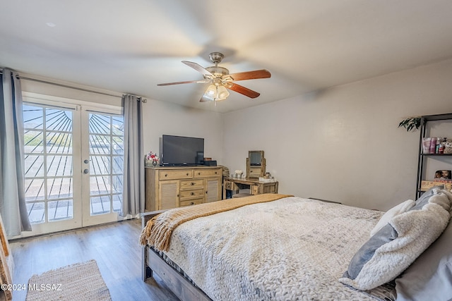 bedroom featuring access to outside, french doors, a ceiling fan, and wood finished floors