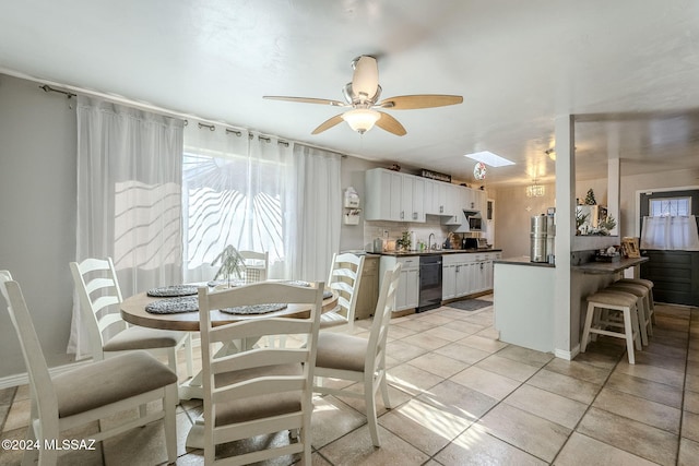 dining space featuring light tile patterned floors and ceiling fan