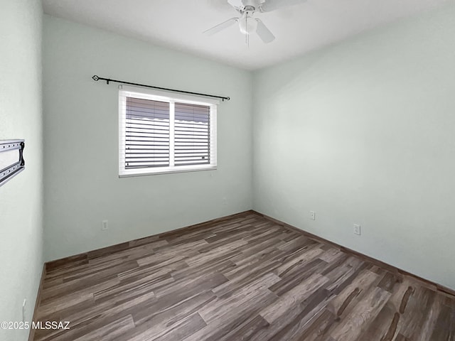 unfurnished room with ceiling fan and wood finished floors