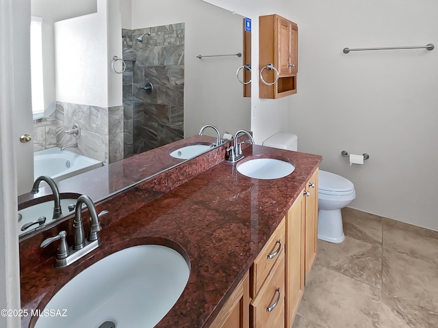 full bath with toilet, a sink, and tiled shower