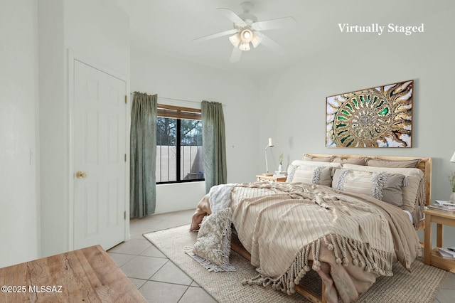 bedroom featuring ceiling fan and light tile patterned floors