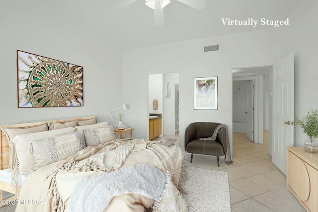 bedroom featuring light tile patterned flooring, connected bathroom, visible vents, and a ceiling fan