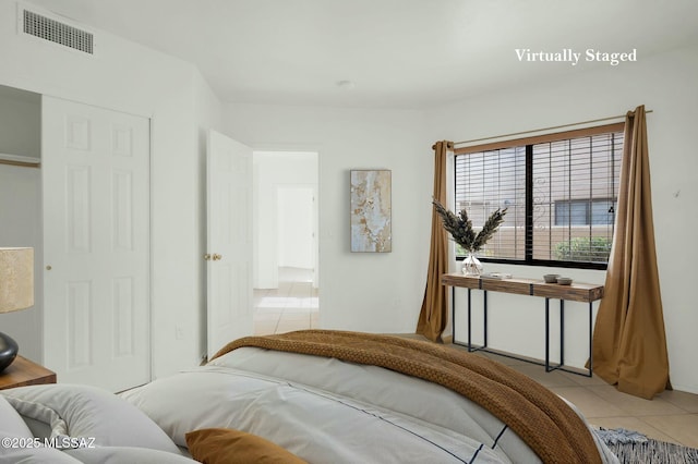 tiled bedroom featuring visible vents