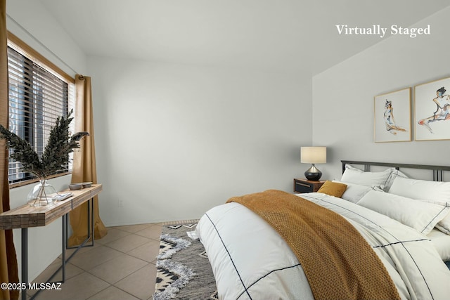 bedroom with tile patterned floors