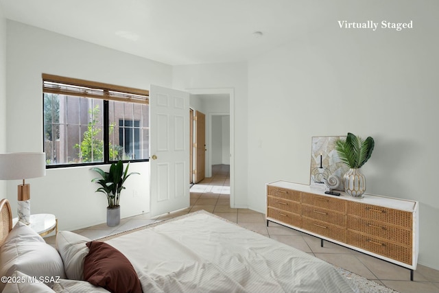 bedroom featuring light tile patterned floors