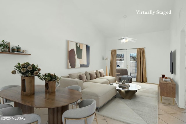 living room featuring french doors, a ceiling fan, light tile patterned flooring, and high vaulted ceiling