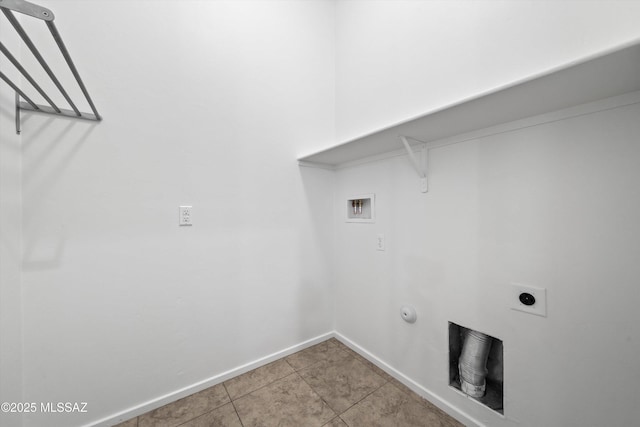 laundry area with laundry area, light tile patterned floors, washer hookup, gas dryer hookup, and baseboards