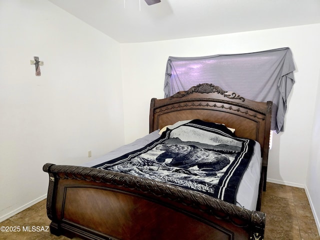 bedroom featuring ceiling fan and baseboards