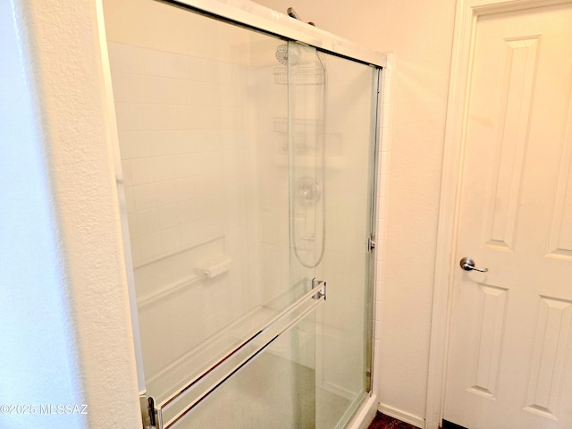 bathroom with a stall shower