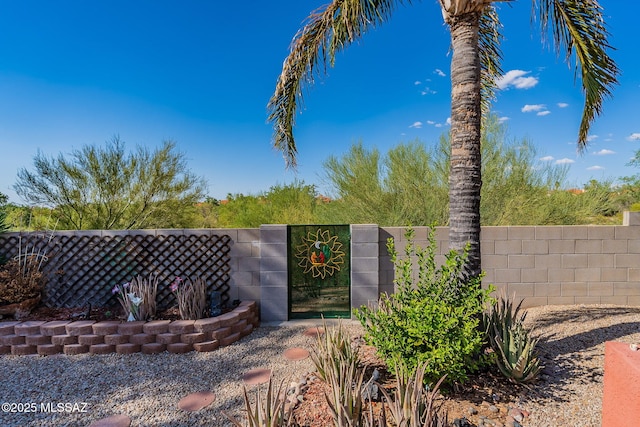 exterior space with a gate and fence