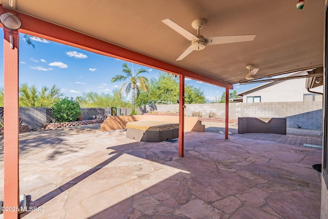 view of patio with a fenced backyard and a ceiling fan