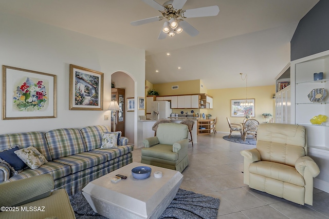 64235 E Greenbelt Ln, Saddlebrooke, AZ 85739 - living room featuring arched walkways, ceiling fan with notable chandelier, light tile patterned floors, and baseboards