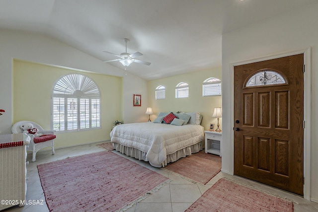 64235 E Greenbelt Ln, Saddlebrooke, AZ 85739 - bedroom featuring light tile patterned floors, ceiling fan, and lofted ceiling