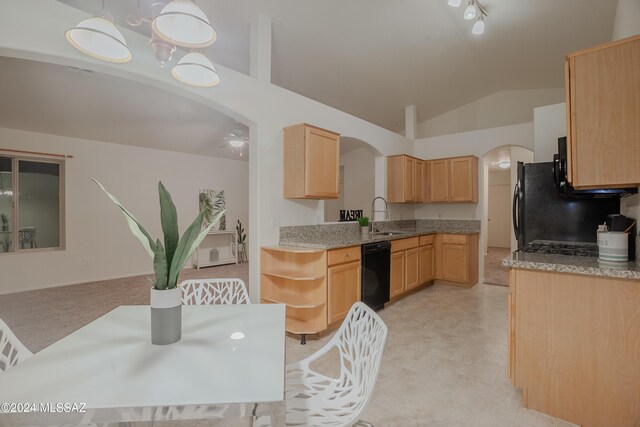 kitchen with lofted ceiling, light brown cabinetry, arched walkways, dishwasher, and a ceiling fan