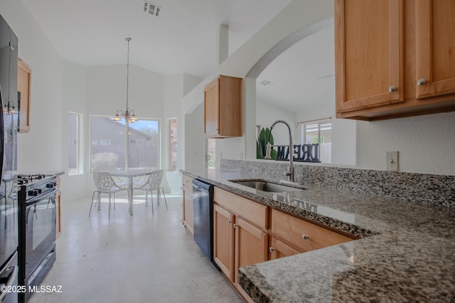 kitchen featuring an inviting chandelier, a sink, black gas range oven, visible vents, and dishwashing machine