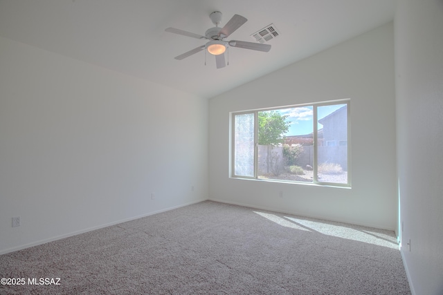 unfurnished room featuring carpet, lofted ceiling, ceiling fan, and visible vents