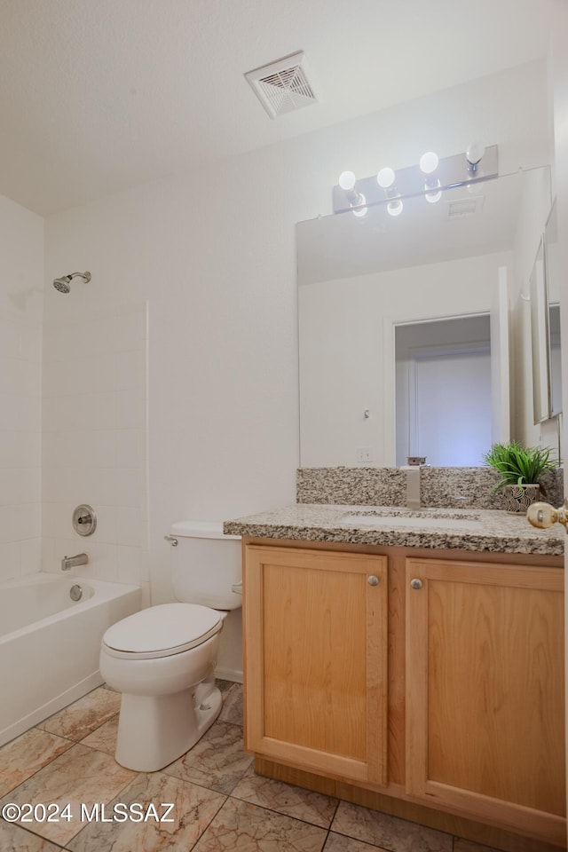 bathroom with washtub / shower combination, visible vents, toilet, and vanity