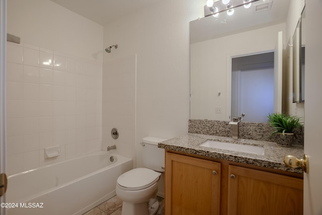 full bath with visible vents, toilet, bathtub / shower combination, vanity, and tile patterned flooring