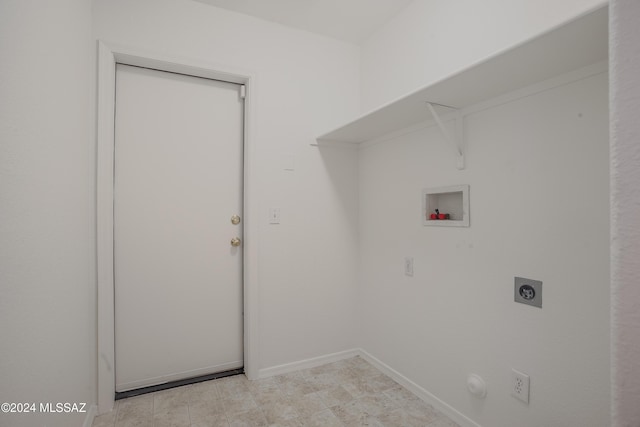 clothes washing area featuring washer hookup, baseboards, laundry area, and electric dryer hookup