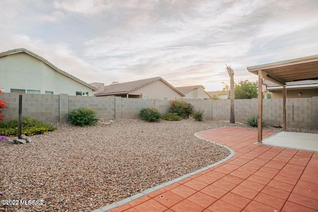 view of yard featuring a fenced backyard and a patio area