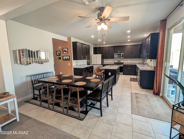 dining area with recessed lighting, light tile patterned floors, visible vents, and ceiling fan