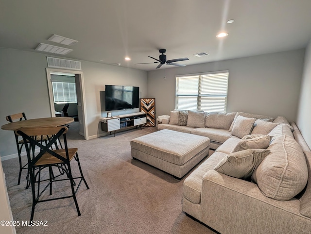 living room featuring carpet floors, ceiling fan, visible vents, and recessed lighting