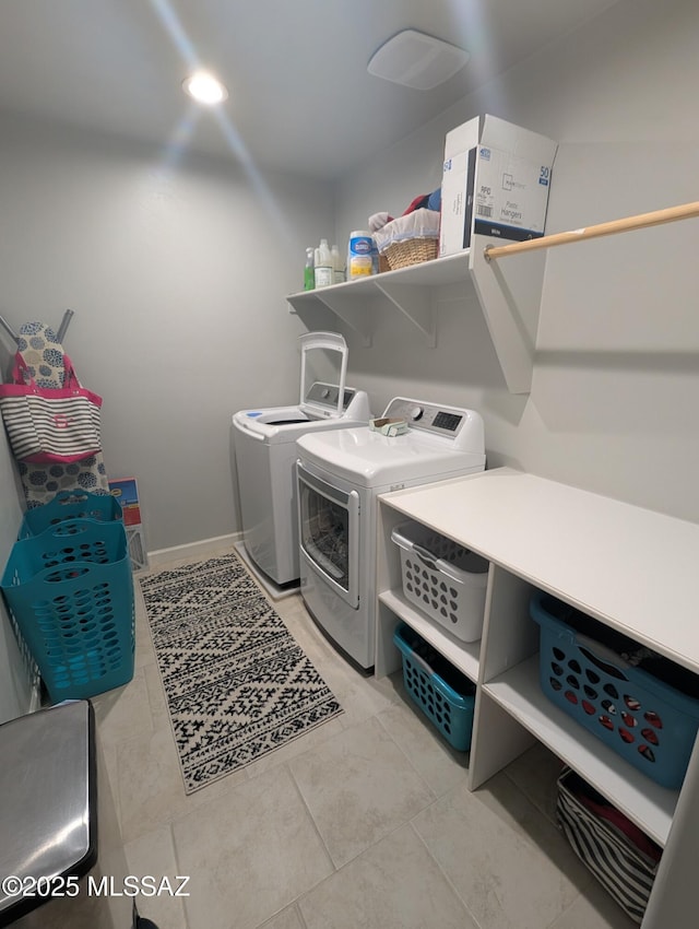 laundry room with washer and dryer and laundry area