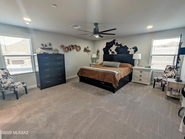 bedroom with light colored carpet, baseboards, a ceiling fan, and visible vents
