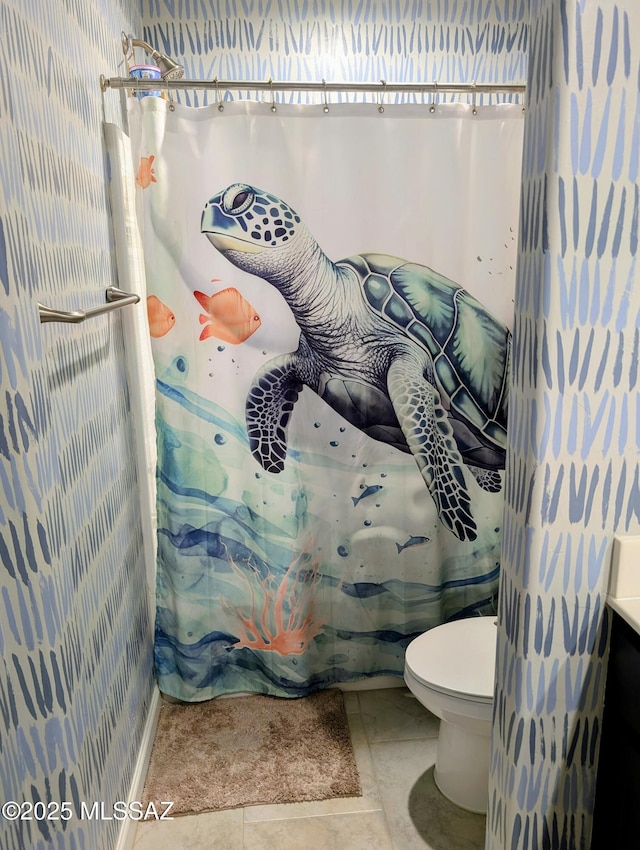 bathroom with toilet and a shower with shower curtain