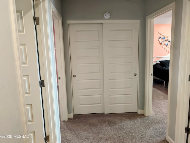 hall featuring carpet