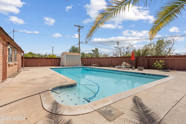 view of pool with a shed, a patio area, a fenced backyard, and a fenced in pool