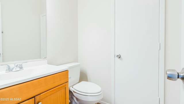 half bath with toilet and vanity