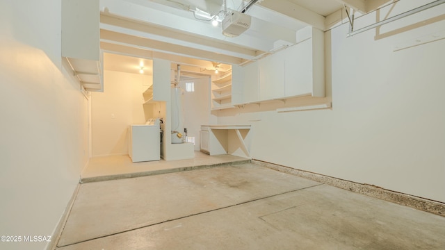 below grade area featuring washer / dryer and baseboards