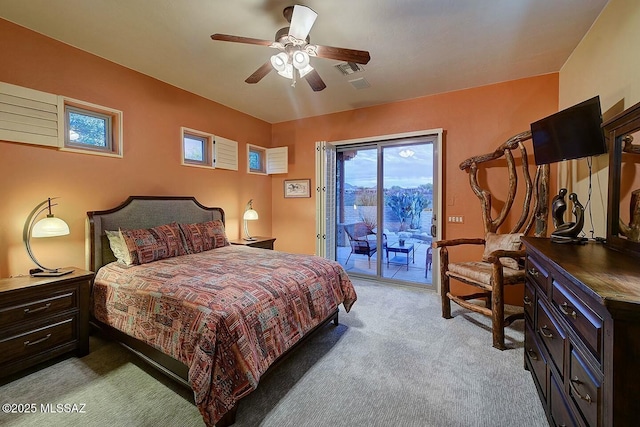 bedroom featuring light carpet, a ceiling fan, visible vents, and access to exterior