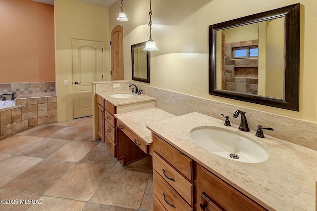 full bathroom featuring a bath, a sink, and two vanities