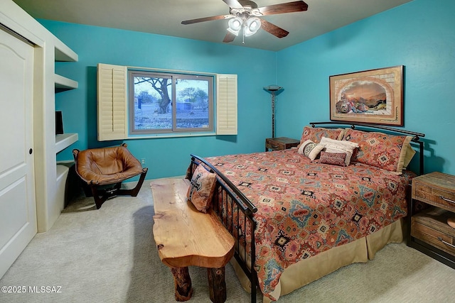 bedroom with a ceiling fan and carpet flooring