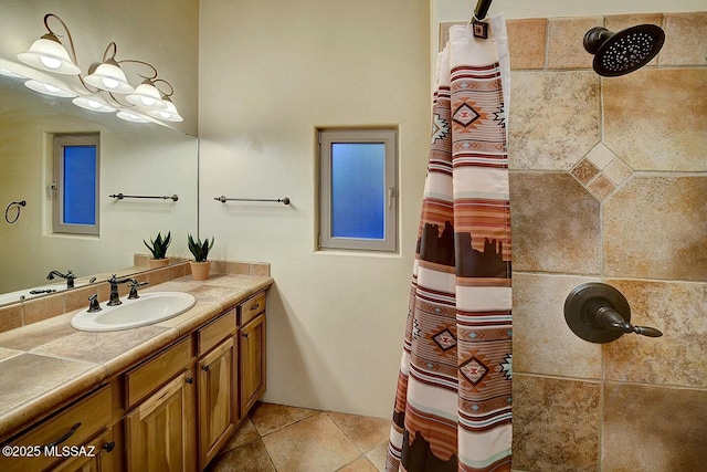 bathroom featuring tile patterned floors, vanity, and a shower with shower curtain